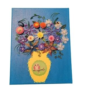 Quilled bouquet of flowers in vase